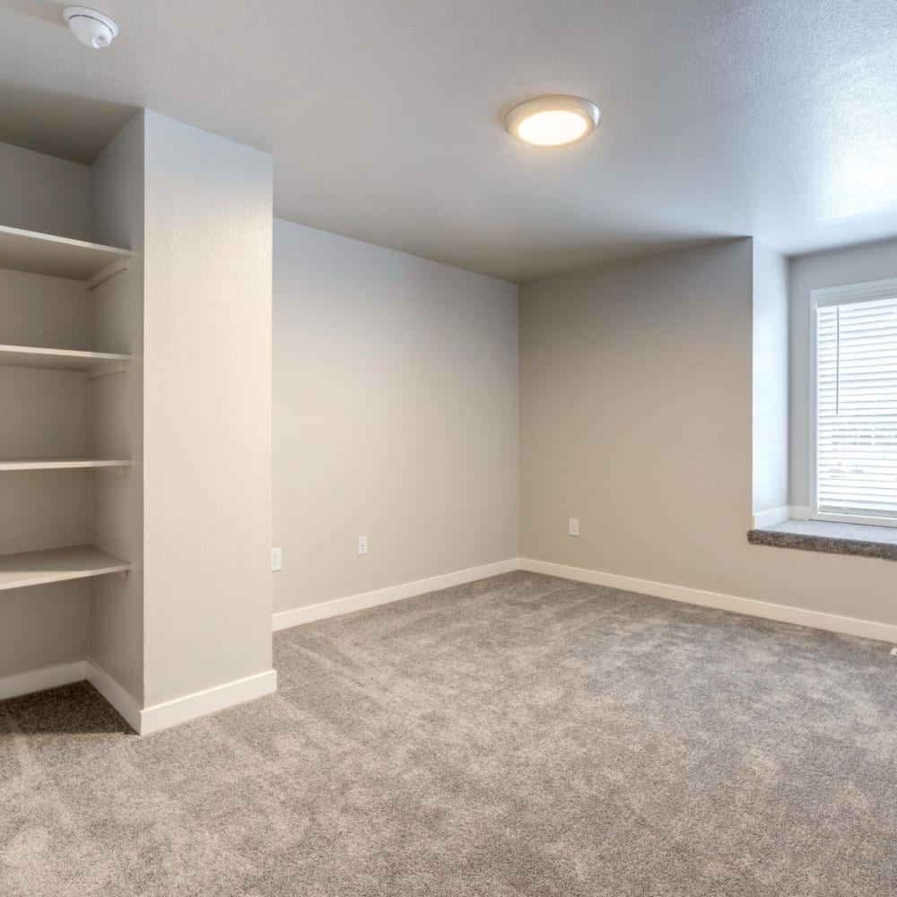 Bedroom with shelving at Townhomes at Mountain View in Puyallup, Washington