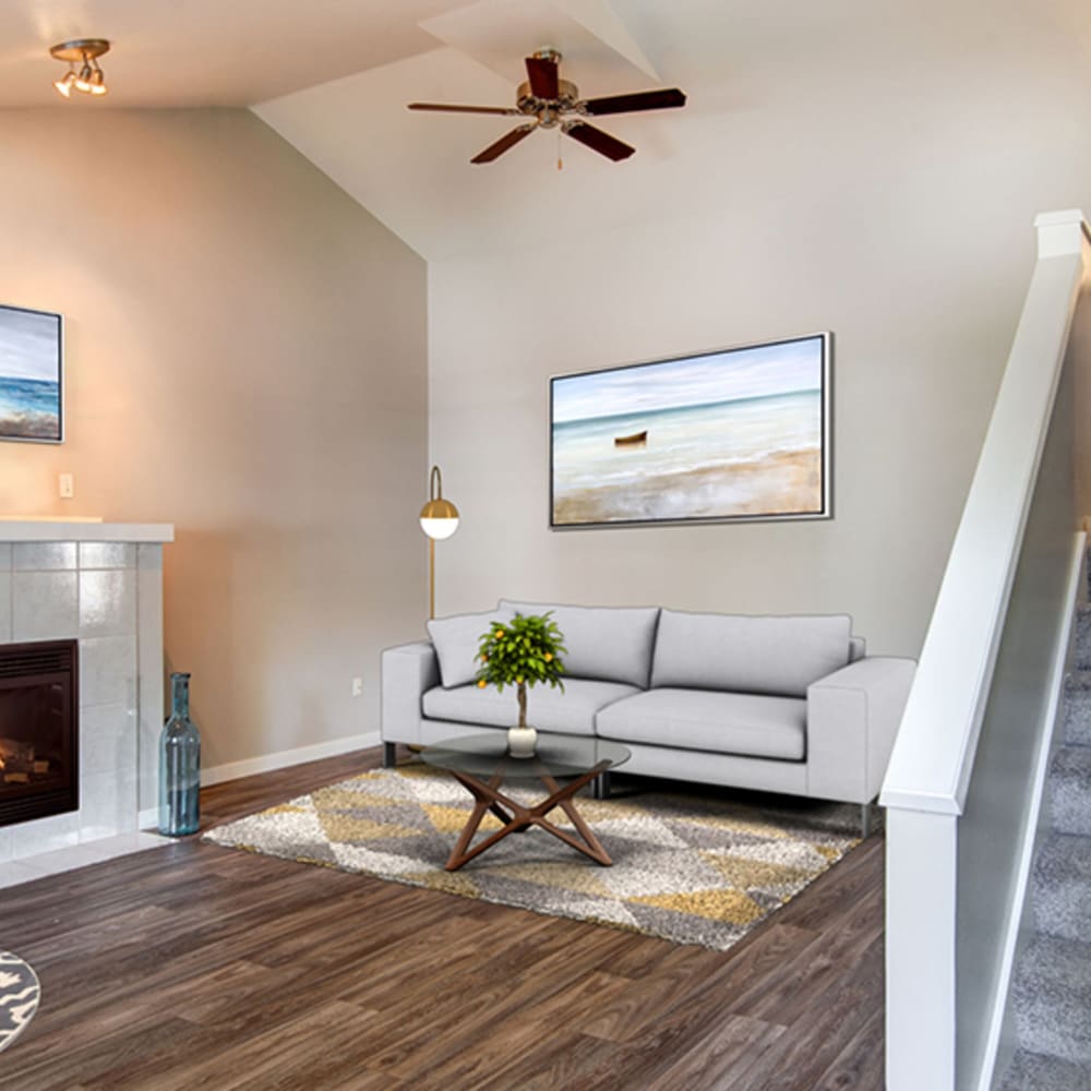 Living space with ceiling fan at Townhomes at Mountain View in Puyallup, Washington