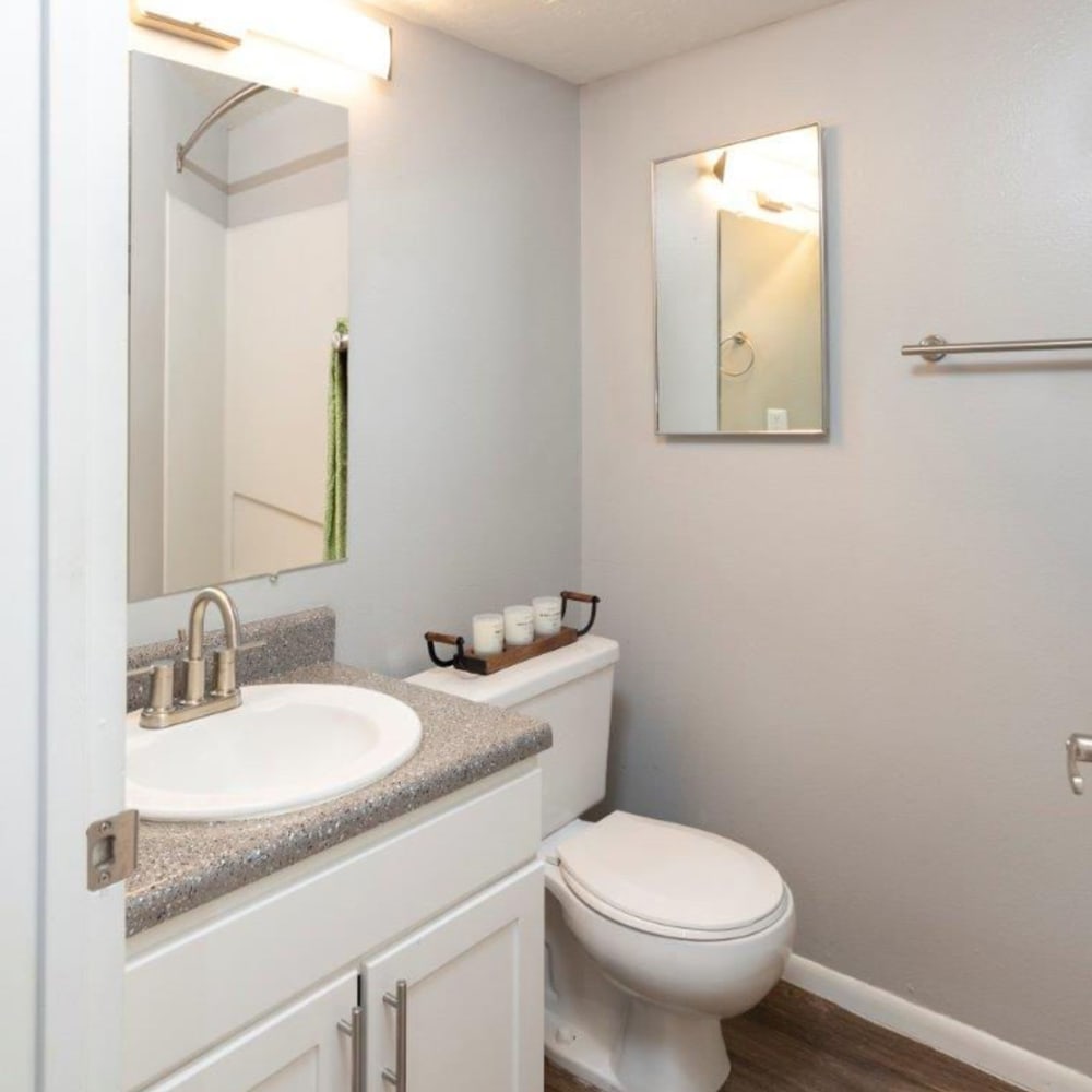 Model bathroom with large mirror at Windgate at Bountiful in West Bountiful, Utah
