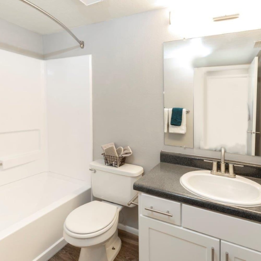 Model bathroom with white accents at Windgate at Bountiful in West Bountiful, Utah