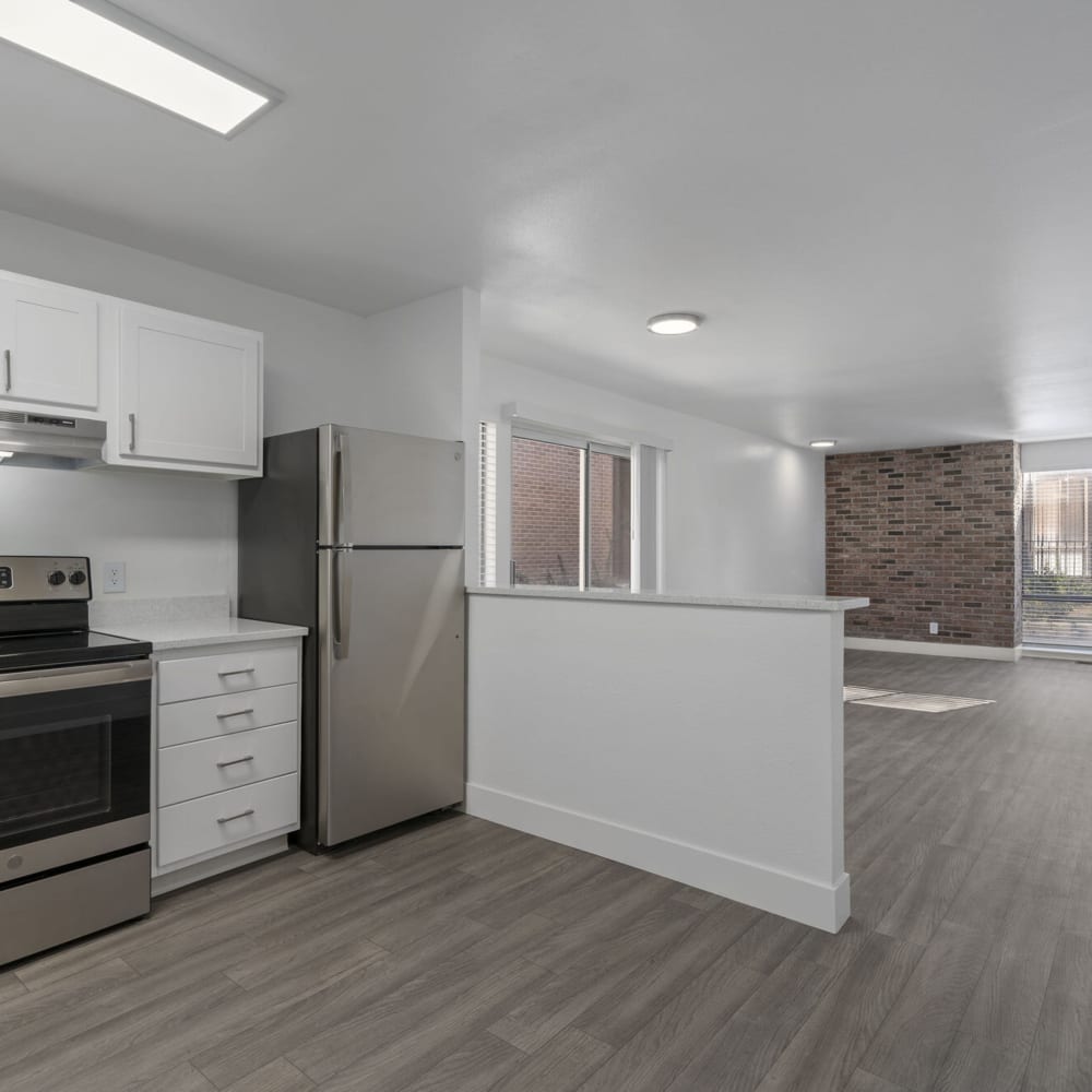 Kitchen leading into living space at The Franklyn Apartments in Millcreek, Utah