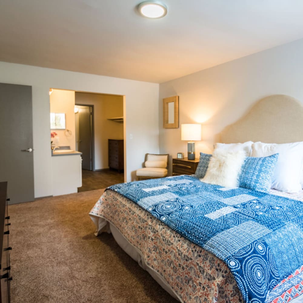 Bedroom with blue accents at Country Lake in Millcreek, Utah