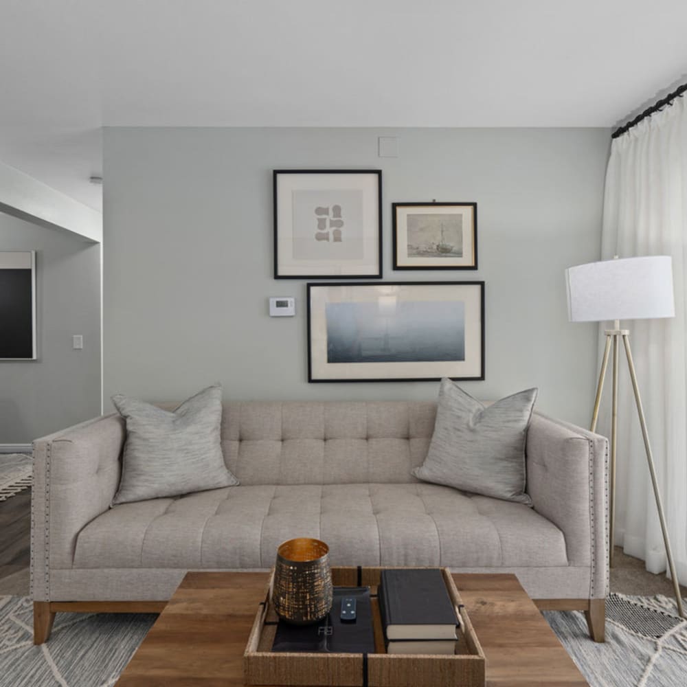 Living space with wall art at Falls at Hunter's Pointe in Sandy, Utah