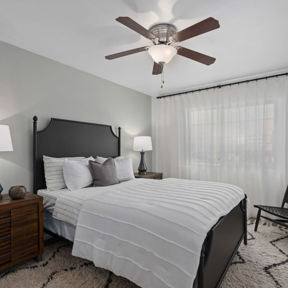 Bedroom with ceiling fan at Falls at Hunter's Pointe in Sandy, Utah
