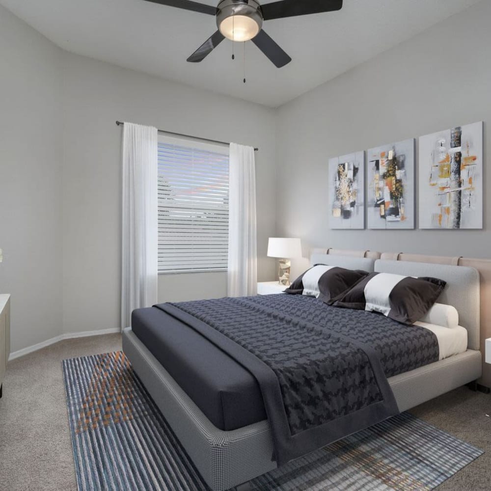 Master bedroom with a ceiling fan at The Fairways at Lake Mary in Lake Mary, Florida