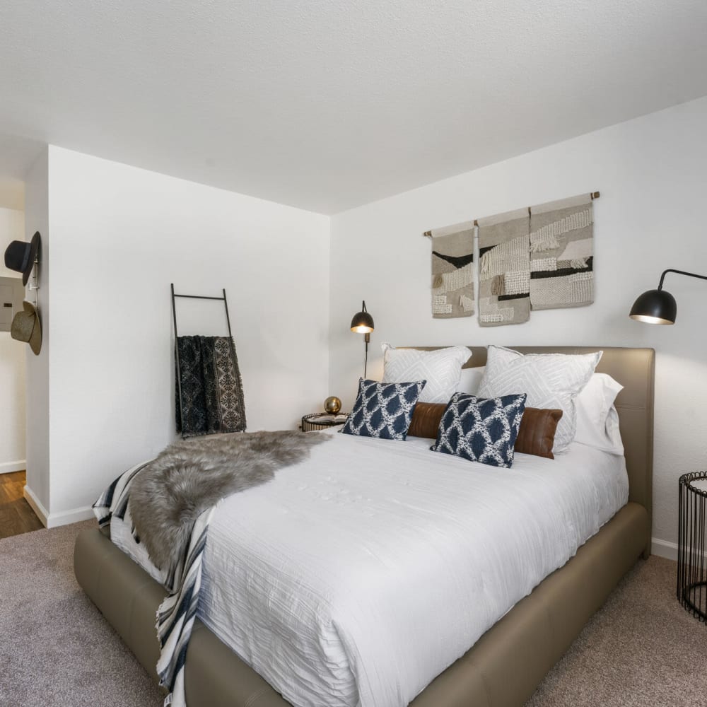 Master bedroom with a large bed at Apex at Sky Valley in Reno, Nevada