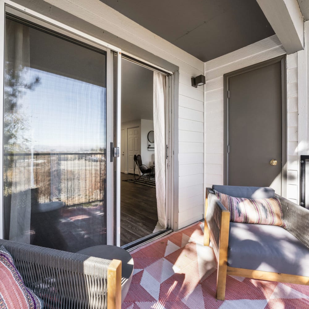 Resident balcony with patio furniture at Apex at Sky Valley in Reno, Nevada