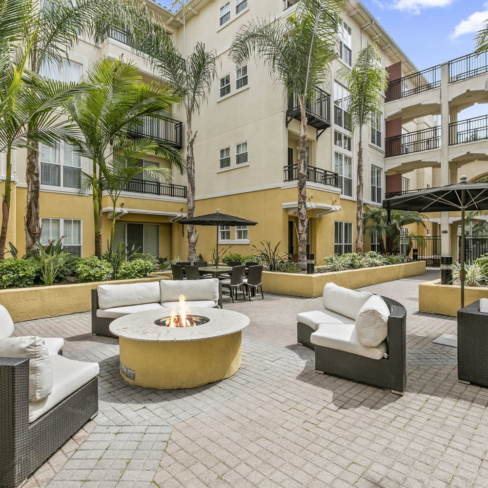 Community courtyard with padded patio couches and chairs at Arpeggio in Pasadena, California 