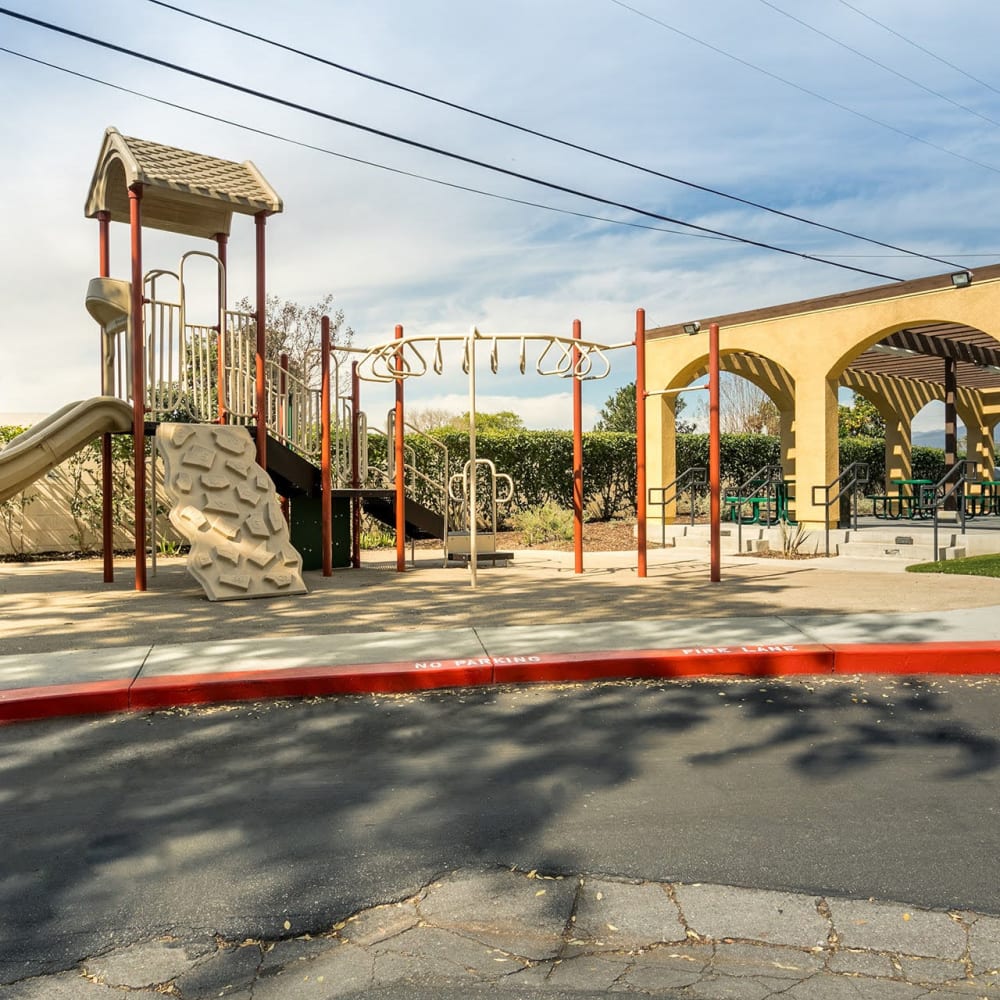 Covered community area next to the playground at Casitas Apartments in Ontario, California