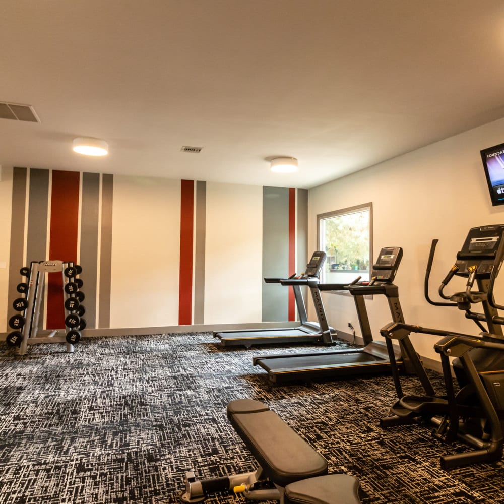 Fitness center with treadmills at The Element Apartments in Reno, Nevada