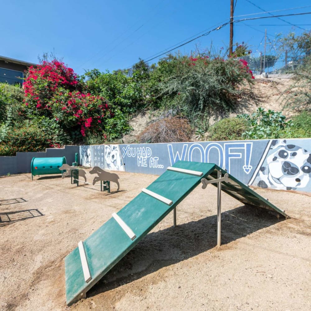 Bark park with pet toys and obstacles at Emerald Hills in Monterey Park, California