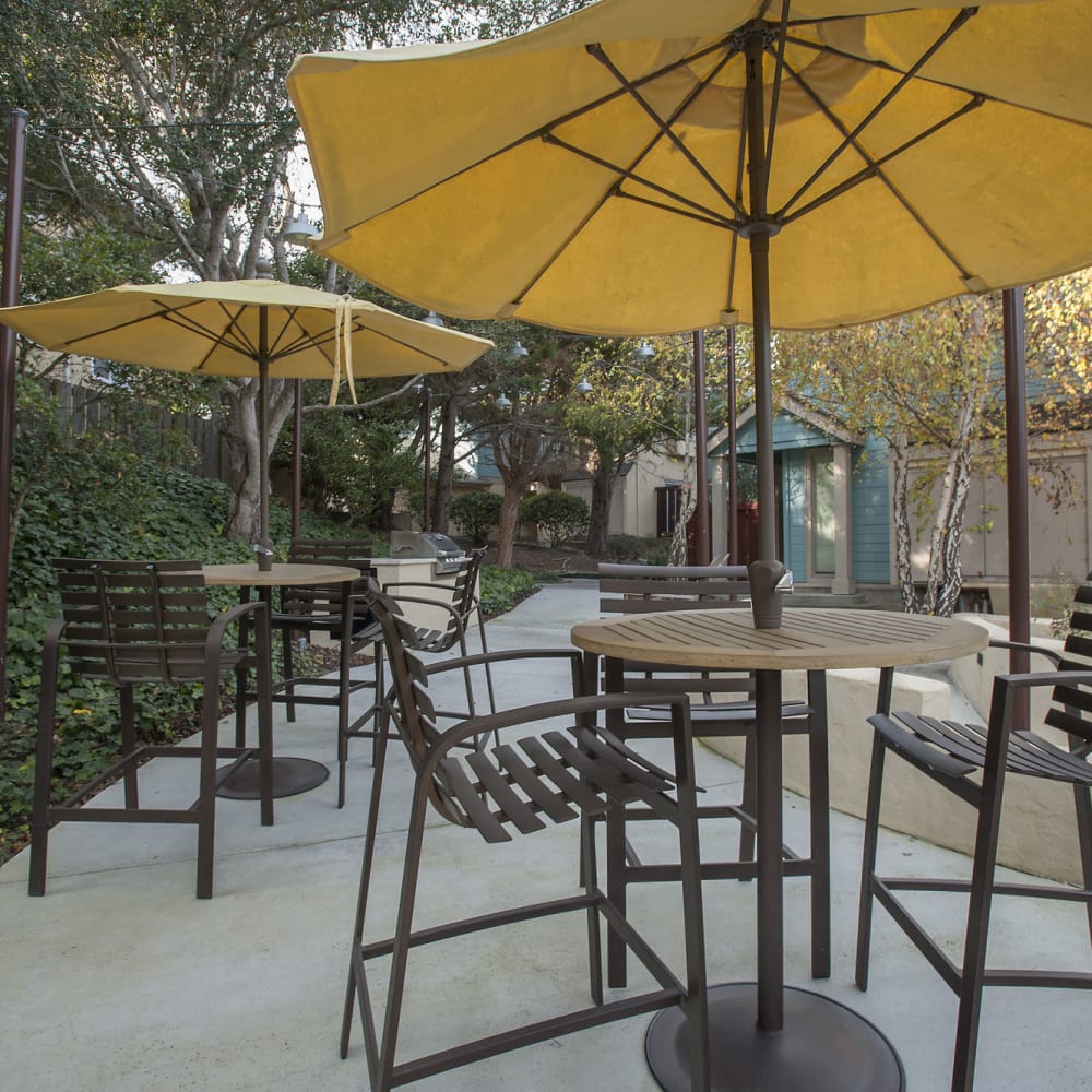 Patio seating with patio umbrellas at Pacific Vista in Presidio Of Monterey, California