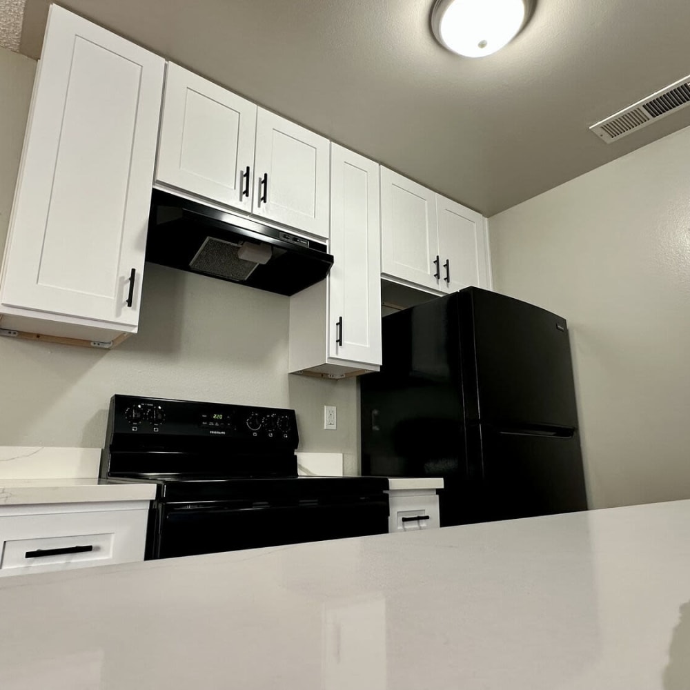 Remodeled kitchen with black appliances at Sheridan Park in Salinas, California