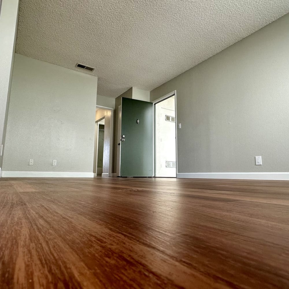 Living space with woo-style flooring at Sheridan Park in Salinas, California