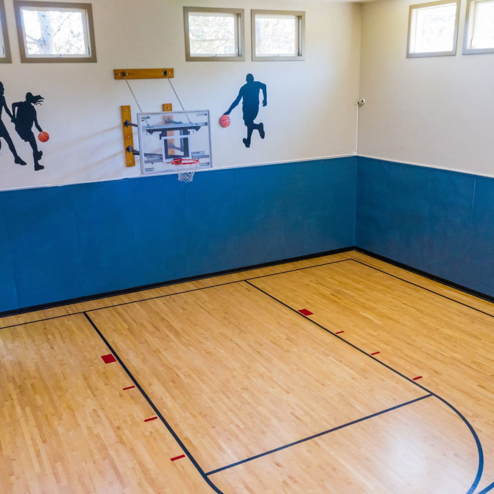 Basketball court with hardwood flooring at The Seasons in Lynnwood, Washington