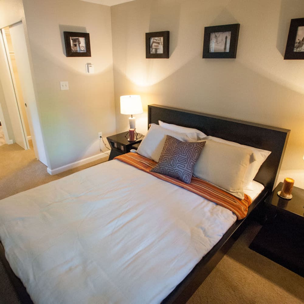 Bedroom with plush carpeting at The Seasons in Lynnwood, Washington