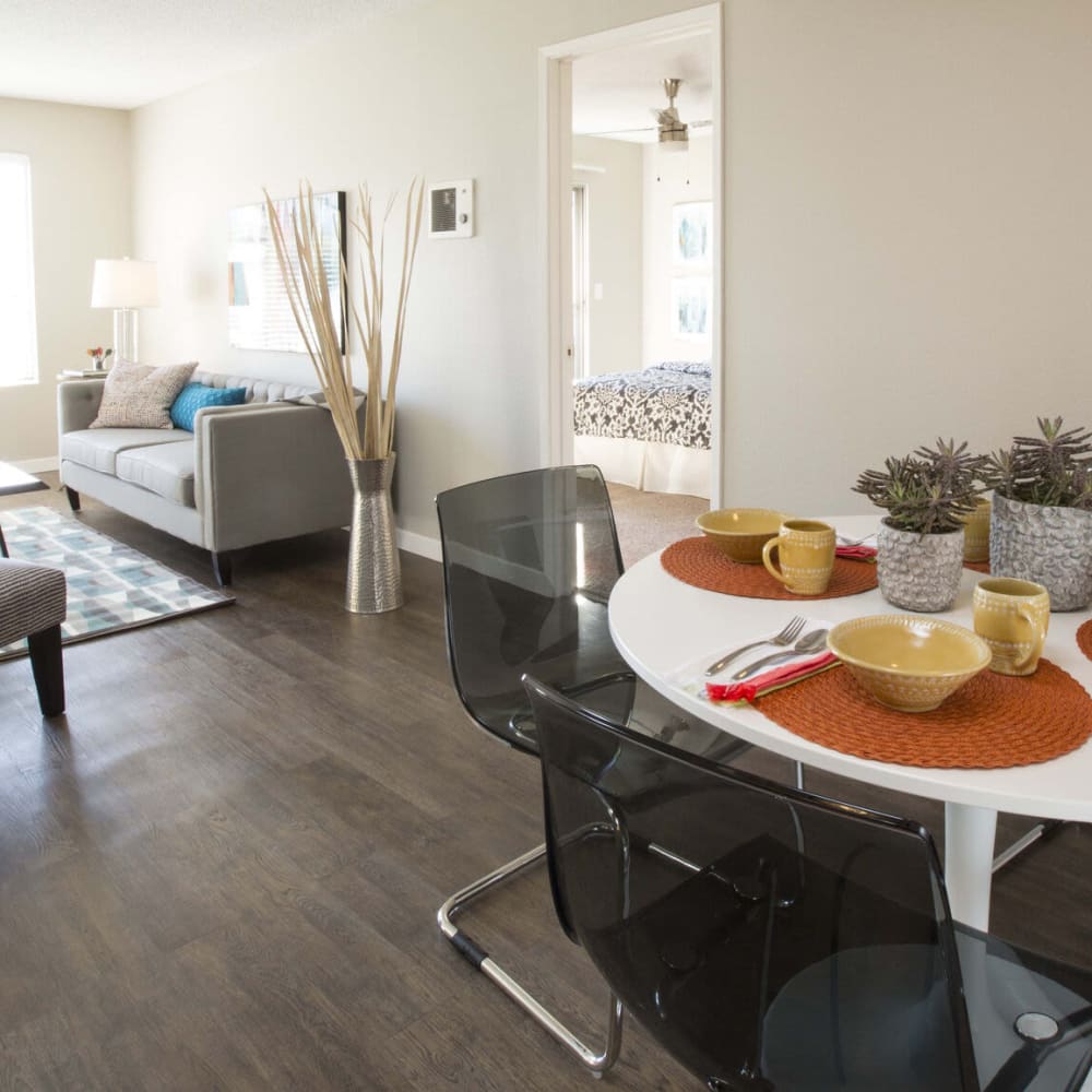 Living space with wood-style floors at Amara Apartments in Santa Maria, California
