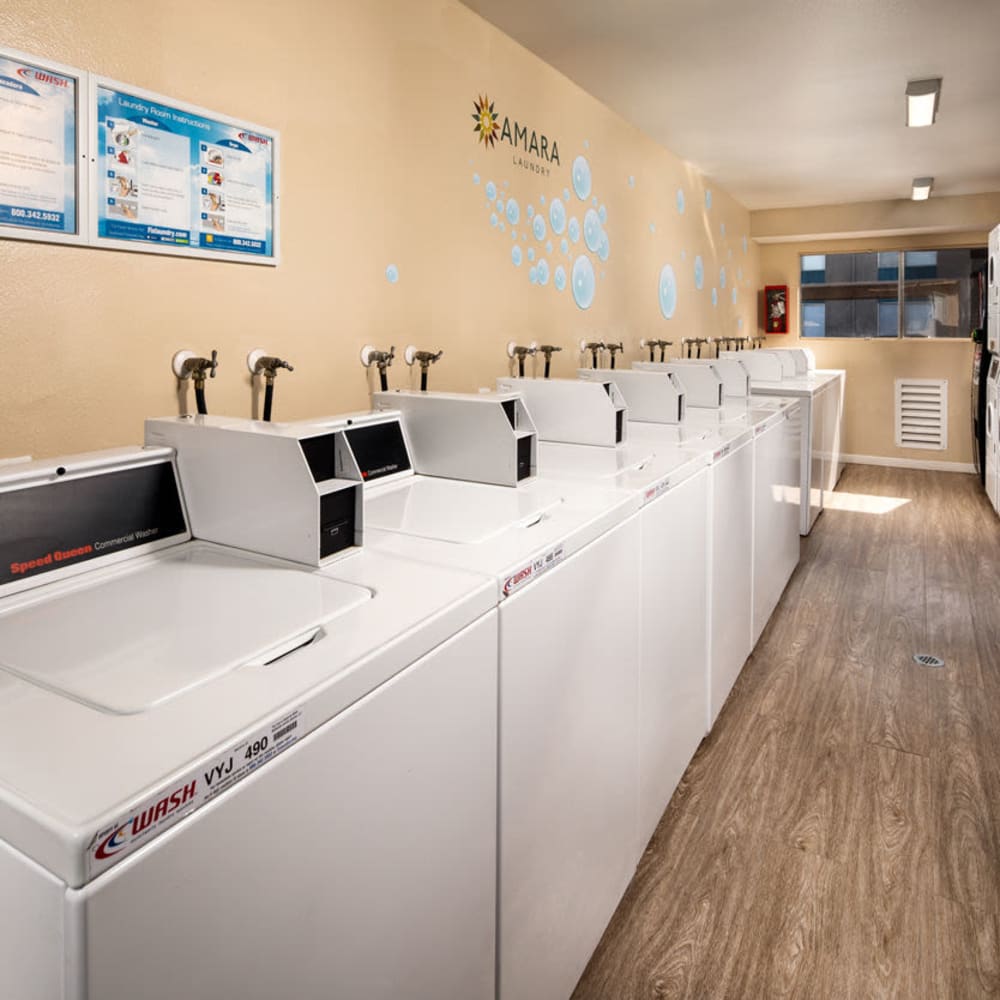 Multiple washers in the laundry facility at Amara Apartments in Santa Maria, California
