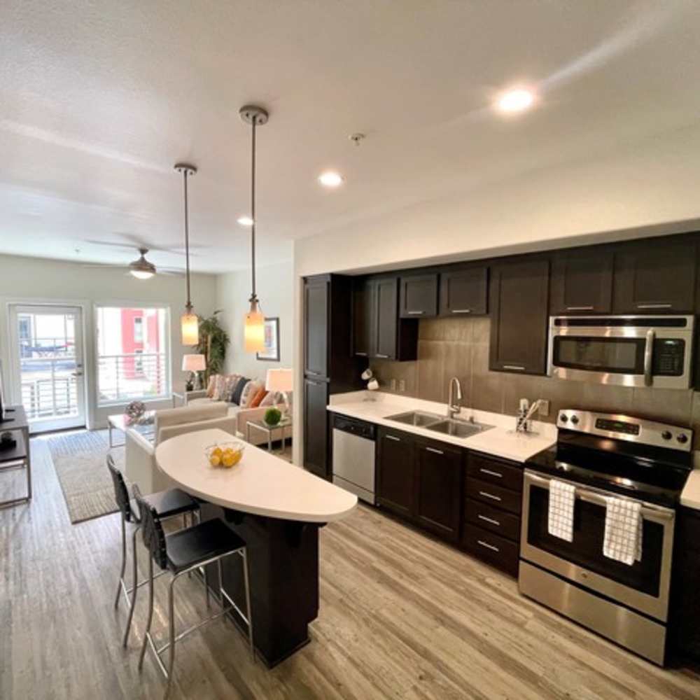 Kitchen with stainless steel appliances at Urbana Rental Flats in San Diego, California