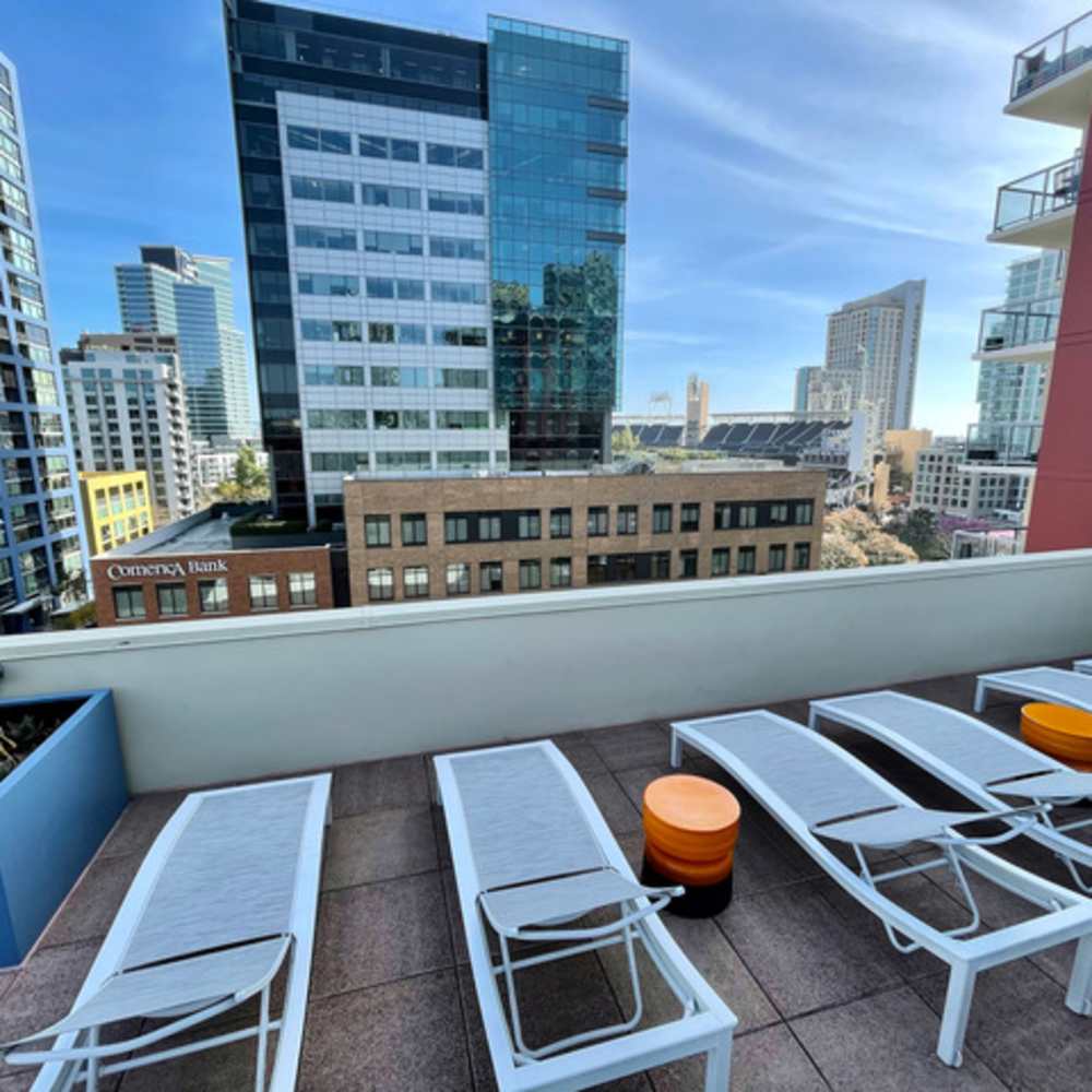 Lounge chairs on rooftop at Urbana Rental Flats in San Diego, California