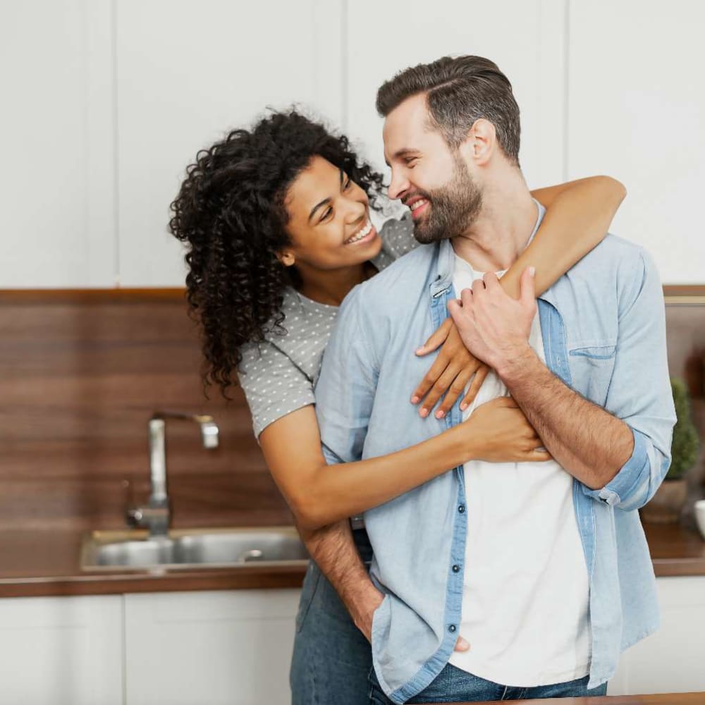 Happy couple in the kitchen at The Averly East Village in Alpharetta, Georgia