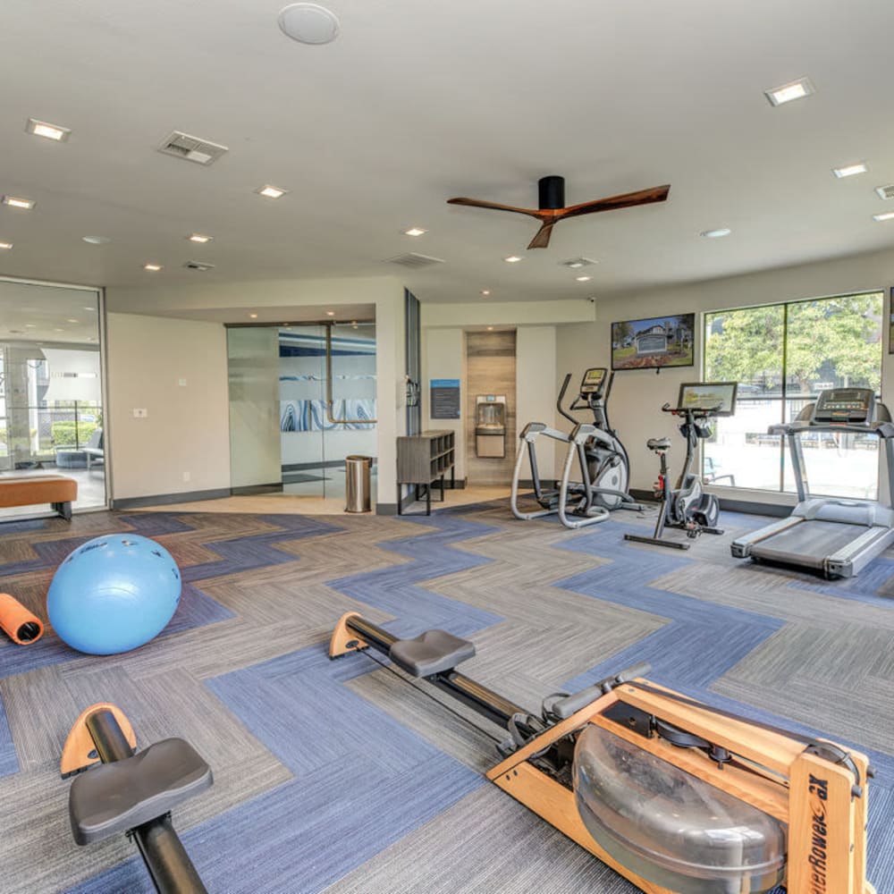 Fitness center with ceiling fan at Cypress Creek in Salinas, California