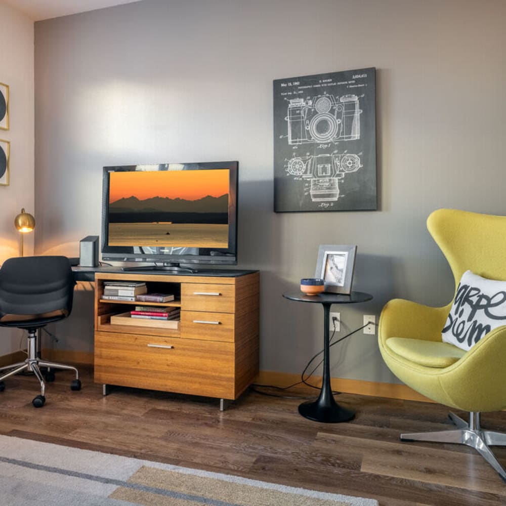 Living space with green chair The Luke in Redmond, Washington