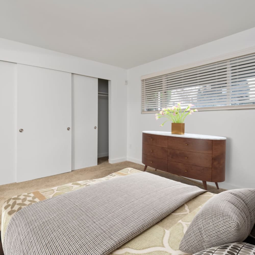 Bedroom with large closets at Bluffs at Evergreen in Everett, Washington