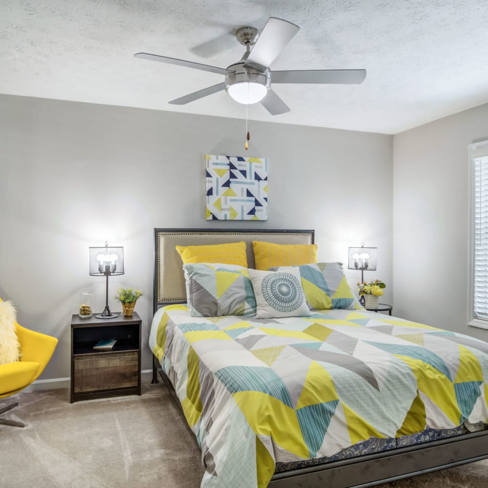 Bedroom with a ceiling fan at Junction at Vinings in Smyrna, Georgia