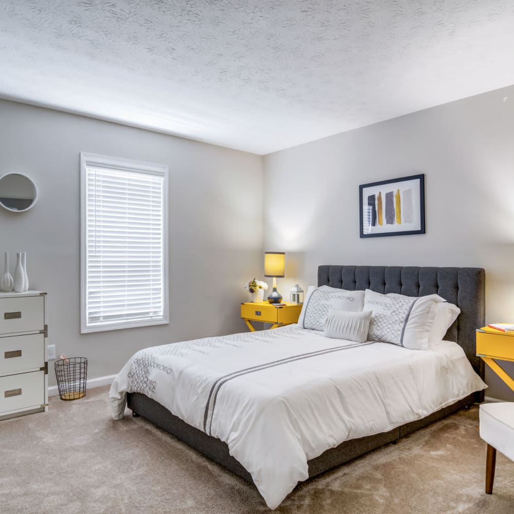 Master bedroom with plush carpeting at Junction at Vinings in Smyrna, Georgia