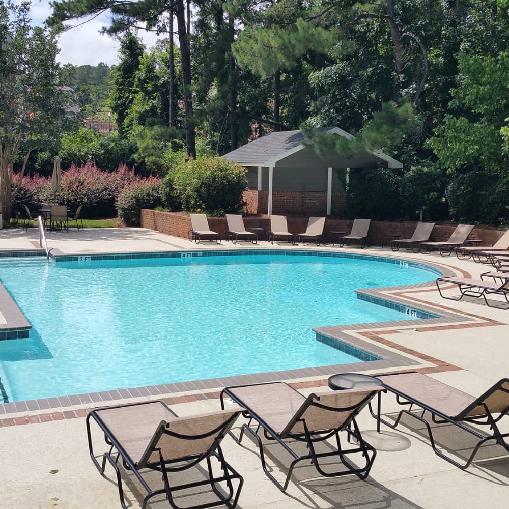 Residents love catching some sun near the pool at Junction at Vinings in Smyrna, Georgia