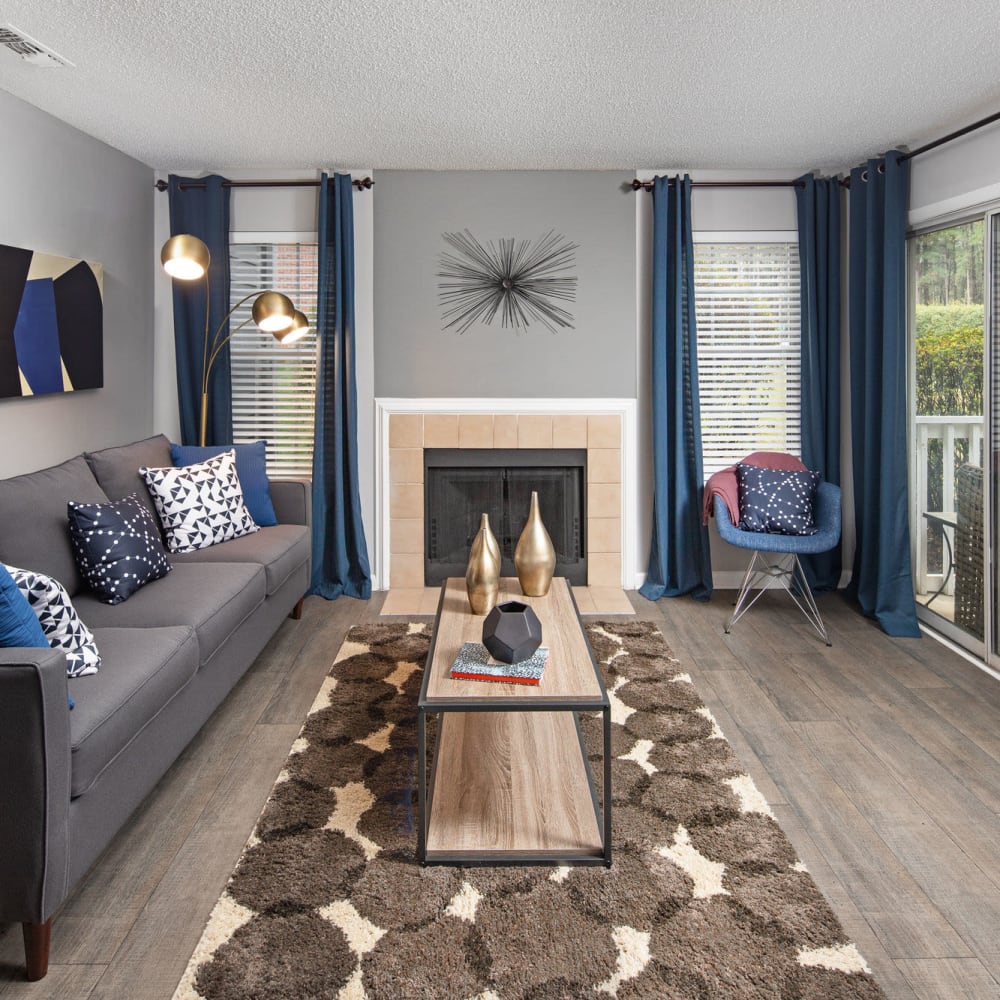 Living space with a fireplace at Bridgeport in Raleigh, North Carolina