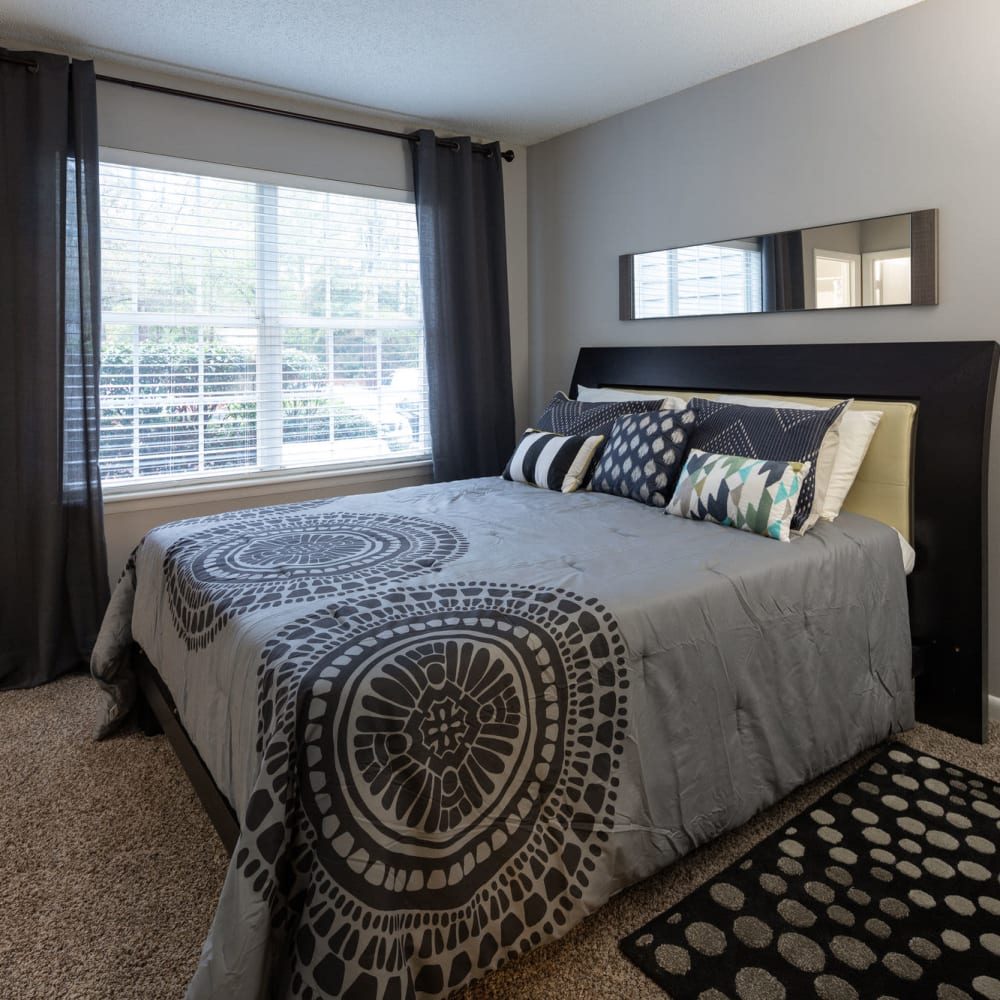 Bedroom with plush carpeting at Bridgeport in Raleigh, North Carolina