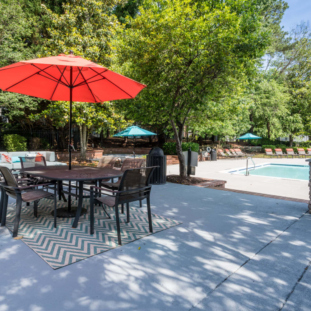 Patio table and chairs with umbrellas at Bridgeport in Raleigh, North Carolina