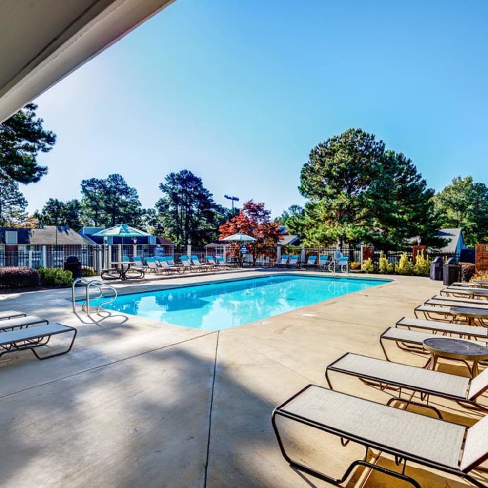 Lounge style chairs surround the pool at Duraleigh Woods in Raleigh, North Carolina