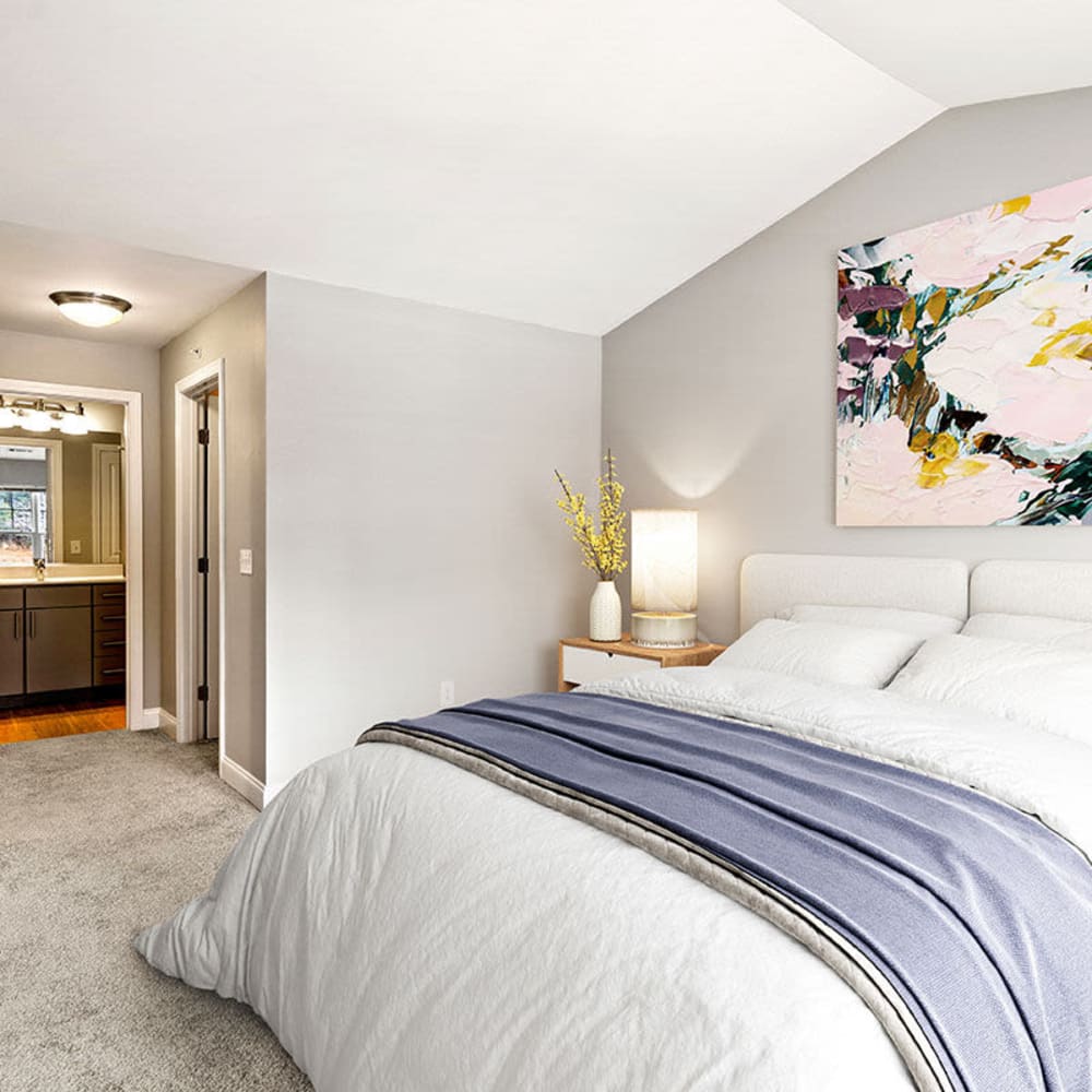 Bedroom with plush carpeting at The Preserve at Cohasset in Cohasset, Massachusetts