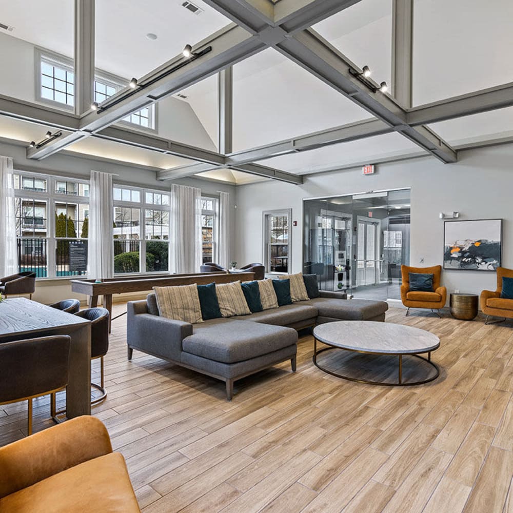 Clubhouse with wood-style flooring at The Preserve at Cohasset in Cohasset, Massachusetts