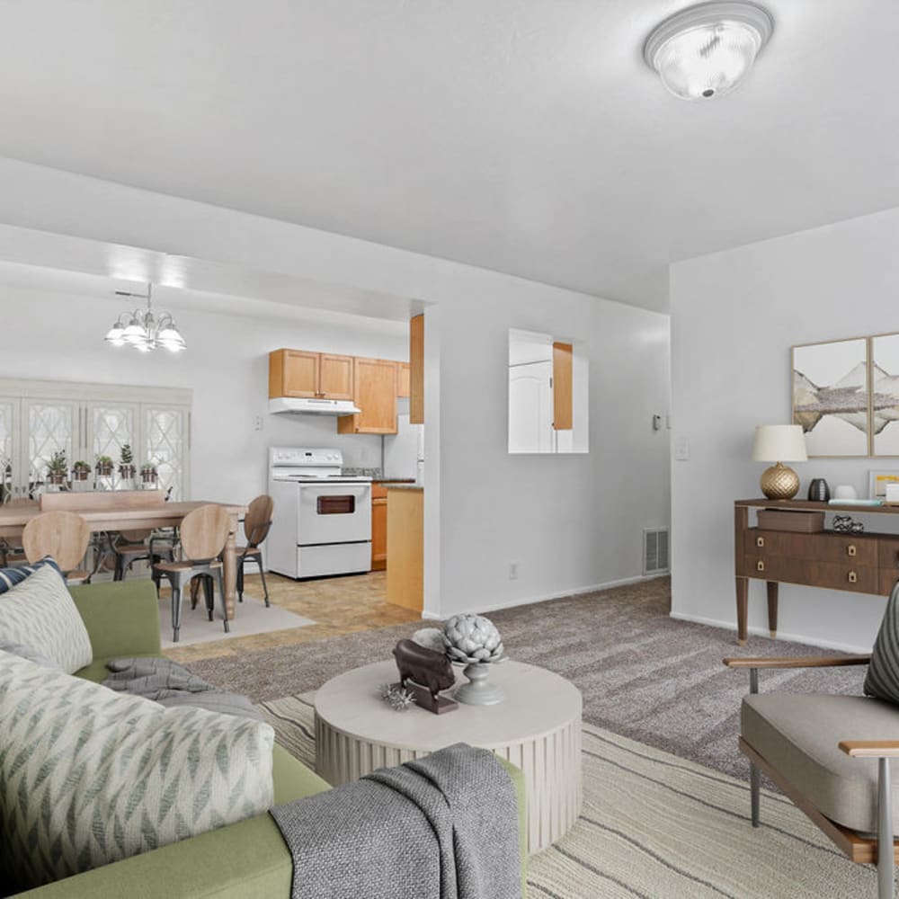 A furnished apartment living rom and dining room at Chadds Ford Apartments in Midvale, Utah