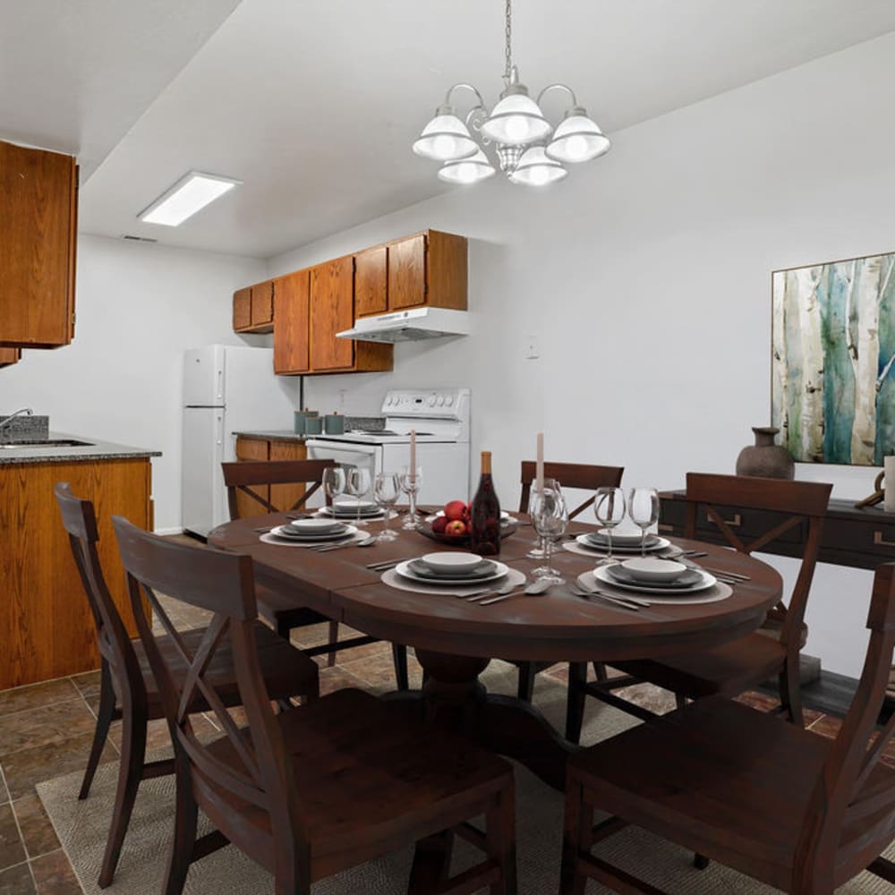 A set dining room table in an apartment at Chadds Ford Apartments in Midvale, Utah