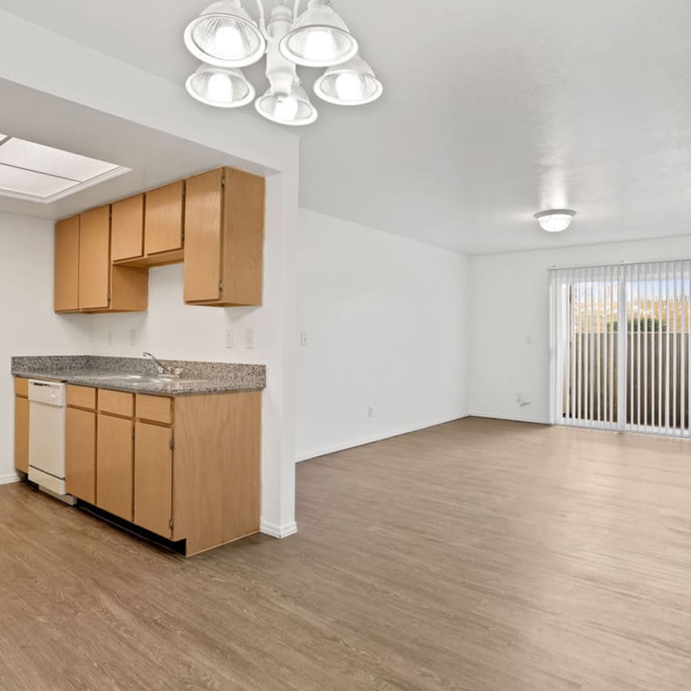 Wood flooring in an apartment kitchen, dining room and living room at Elk Run Apartments in Magna, Utah