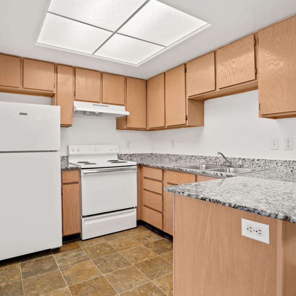 Granite countertops in an apartment kitchen at Elk Run Apartments in Magna, Utah