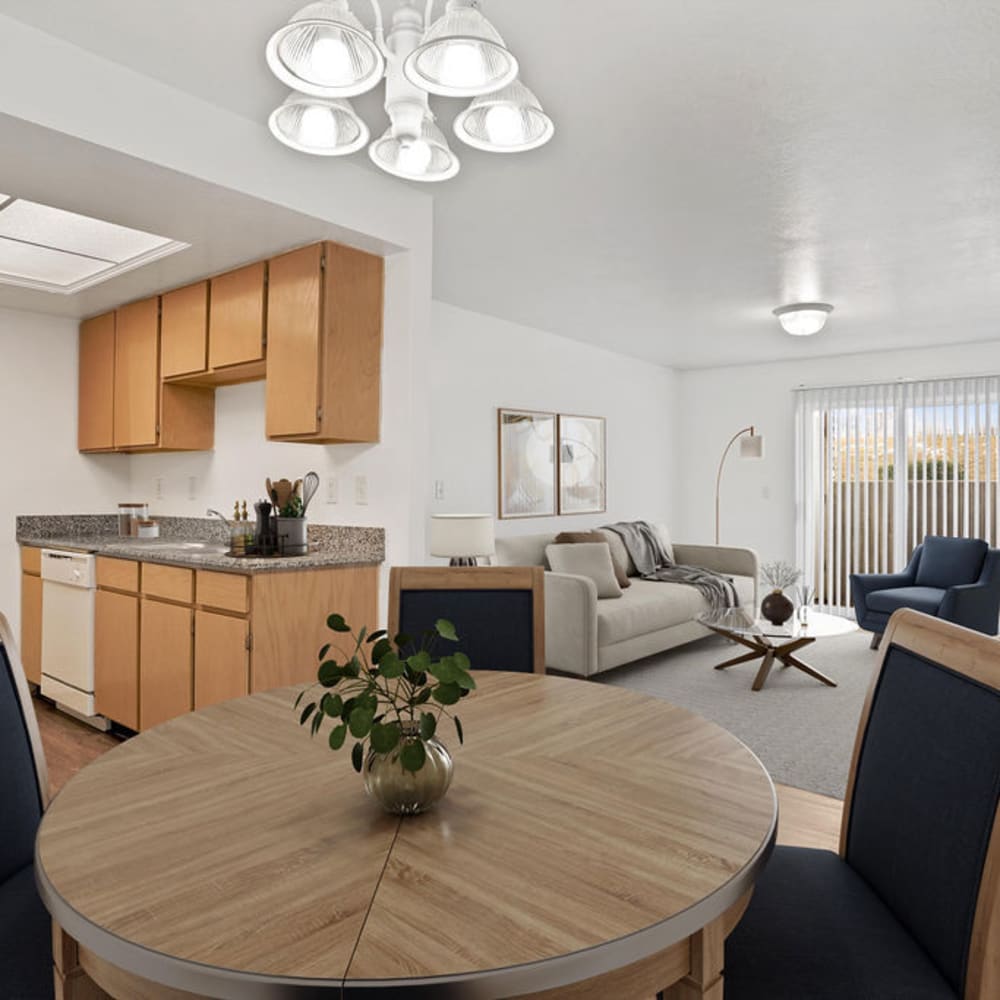 A dining table and chairs in an apartment at Elk Run Apartments in Magna, Utah