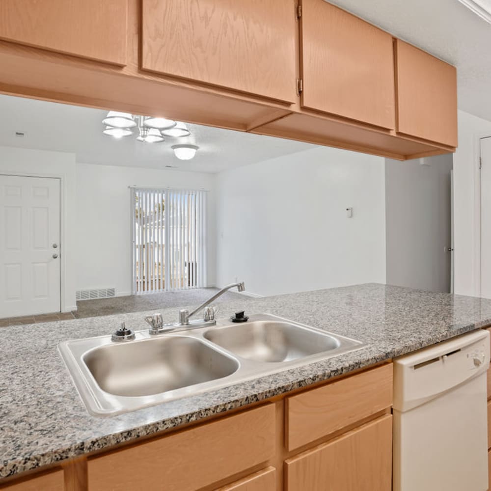 An apartment counter with a stainless-steel sink at Highland Pointe Apartments in Cottonwood Heights, Utah