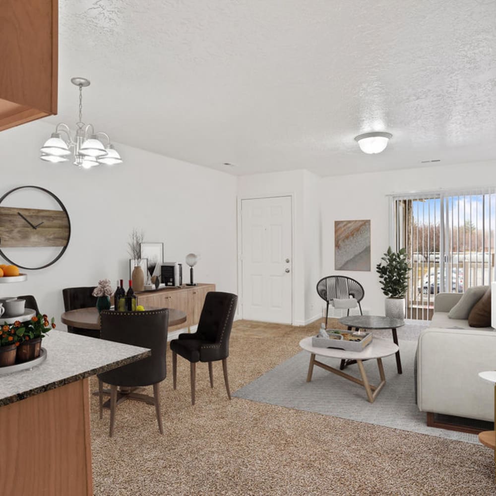 A furnished apartment living room and dining room at Highland Pointe Apartments in Cottonwood Heights, Utah