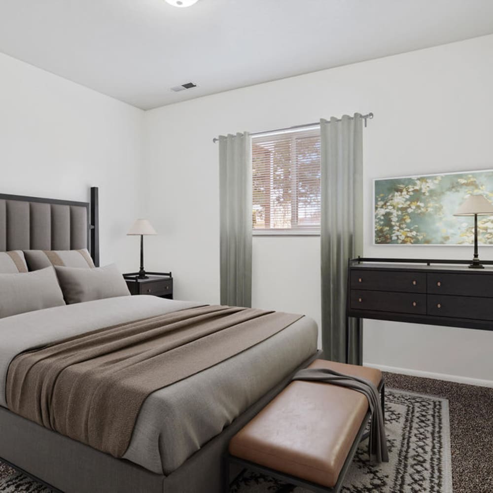 A furnished apartment bedroom at Lincoln Park Apartments in Taylorsville, Utah