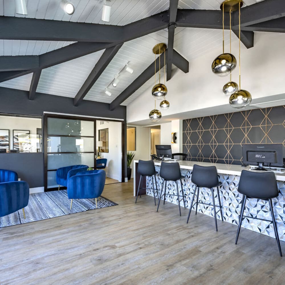 Clubhouse with wood-style flooring at The Pointe at South Mountain in Phoenix, Arizona