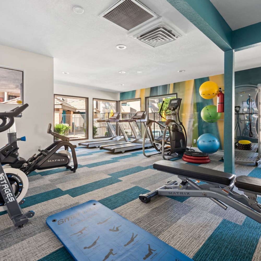 Fitness center with ample natural light at The Bella in Phoenix, Arizona