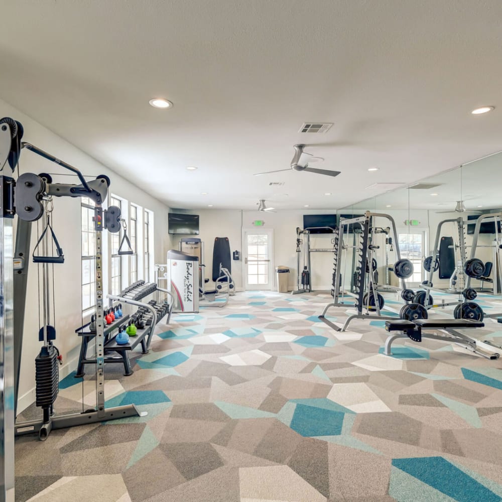 Fitness center with exercise machines at Artemis at Spring Canyon in Colorado Springs, Colorado
