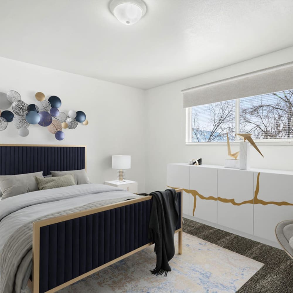 A furnished apartment bedroom at Mark Twain Apartments in Salt Lake City, Utah