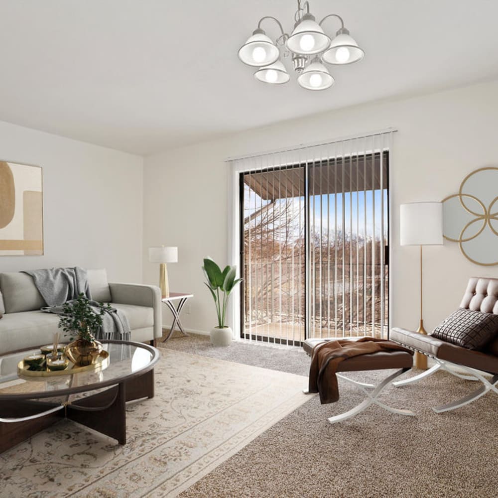 A furnished apartment living room with a sliding door to the patio at Regency Apartments in Salt Lake City, Utah